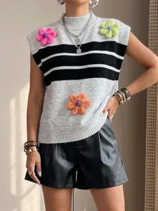 Sleeveless knitted vest with stylish colorblock stripes and charming 3D floral crochet details.