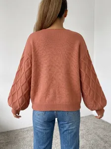 Detailed back view of women knit sweater featuring trendy lantern sleeves and cozy knit texture.
