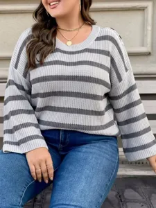 Close-up detail of plus-size grey striped knit sweater featuring shoulder button accents