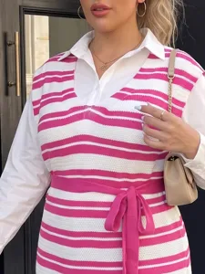 Close-up of pink and white striped knitted vest with adjustable waist tie