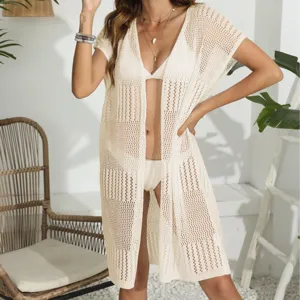 Women hollow knit beach cover up short sleeve open front cardigan for summer vacation wear.
