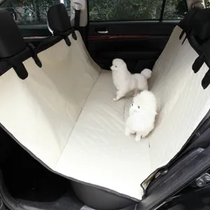 Detail view of waterproof pet car seat cover, beige quilted dog back seat mat for clean travel.