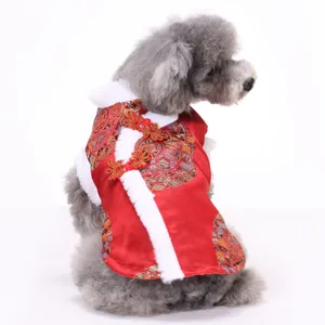 Red Chinese style pet winter coat for dogs, festive New Year Tang suit with plush trim.