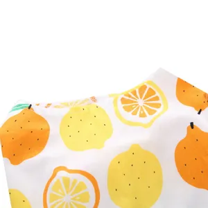 Detail shot of the neckline on a cute dog summer dress with bright lemon print