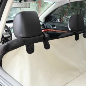 Waterproof pet car seat cover for back seat, durable dog car mat protector with secure straps.