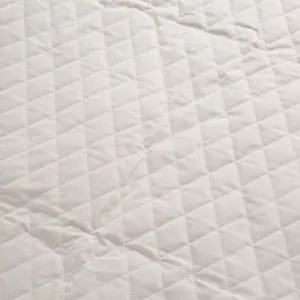 Detailed close-up view of durable quilted pet car seat cushion fabric with diamond stitching.