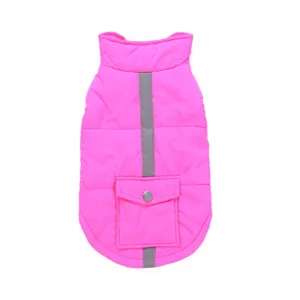 Close-up detail of the bright pink pet winter jacket, featuring a reflective stripe and pocket.