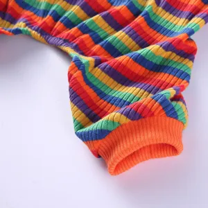 Colorful striped pet pajamas detail shot, soft knit four-leg dog clothing for daily wear.