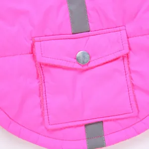 Detail shot of bright pink pet winter coat with reflective stripes and pocket for dogs.