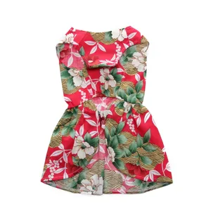Detailed view of red floral pet summer dress with beautiful white blossom patterns