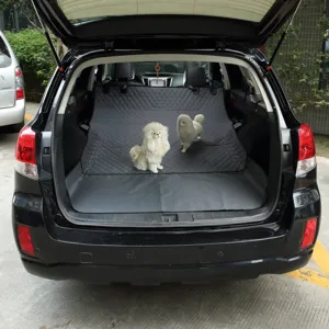 Waterproof dog car trunk mat detail view, showing durable quilted dark grey pet liner in vehicle.