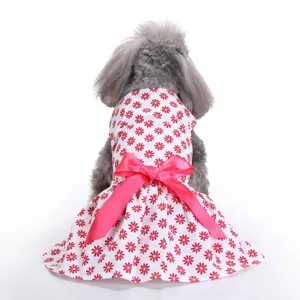 Back view detail of a cute red floral dog summer dress featuring a large pink ribbon bow
