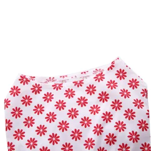 Close-up of pet summer dress with red daisy floral pattern and neckline stitching