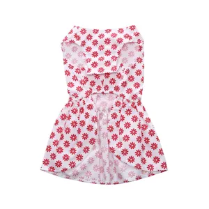 Detailed view of a white pet summer dress featuring a vibrant red daisy floral print.