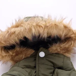 Detail view of the green pet winter coat with plush fur hood for small dogs and puppies.