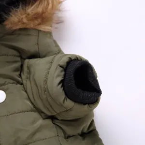 Pet winter jacket detail showing warm faux fur hood, quilted olive green fabric and cuff.