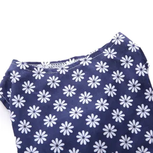 Close-up detail of the neckline on a navy blue daisy print pet summer dress