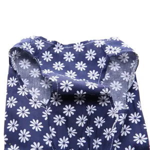 Detailed view of navy blue dog summer dress with white daisy floral print pattern