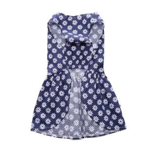Close-up detail of a cute blue dog summer dress featuring white daisy floral prints