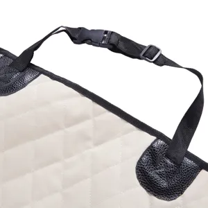 Detail of pet car seat cover strap and buckle, waterproof beige dog mat with durable black leather trim