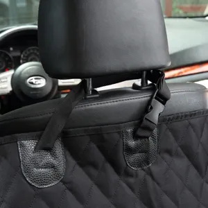 Detailed view of black quilted waterproof pet car seat cover with secure adjustable straps.