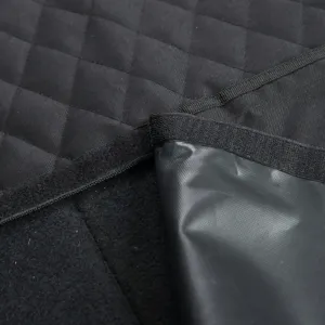 Waterproof quilted pet car seat cover detail showing durable fabric and fastener straps.