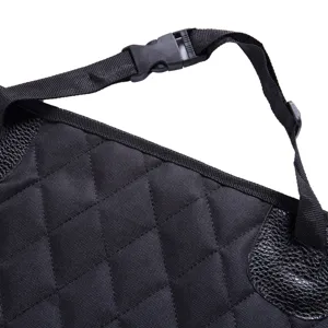 Waterproof pet car seat cover detail, black quilted fabric with sturdy strap buckle and patch.