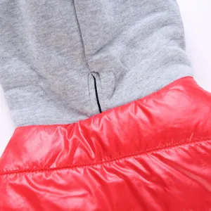 Pet apparel detail featuring grey fleece hoodie and red glossy puffer fabric for small dogs.