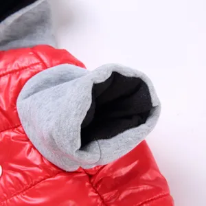 Close-up detail of winter pet puppy jacket with red puffer and grey fleece sleeves.