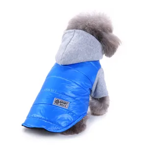 Detail view of warm winter pet dog clothes, blue quilted vest with grey hoodie for small dogs.