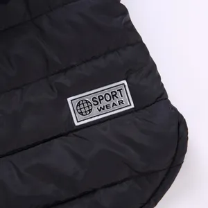 Black quilted pet winter jacket detail, warm dog cotton vest for small and medium dogs.