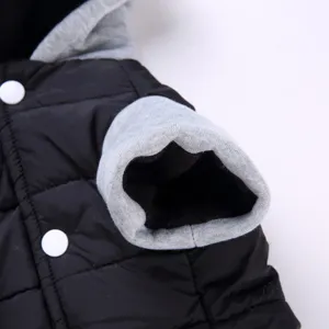 Detail of pet winter warm jacket for small dogs, black quilted coat with grey hood.