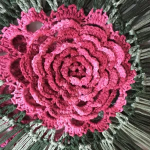 Hand crocheted gradient pink flower pattern sleeveless knit cover up top detailed macro view