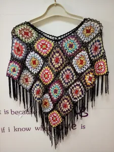 Handcrafted colorful crochet granny square poncho bohemian sleeveless fringe top style.