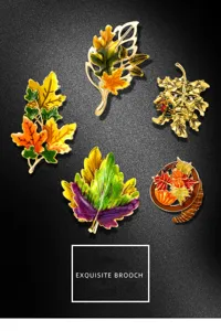 Detail shot of five diverse vintage maple leaf enamel brooches for fall