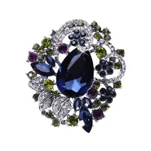 Detailed view of a large vintage Bohemian style crystal brooch in deep blue