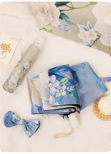 Detailed view of the three-fold floral sun umbrella featuring elegant Chinese peony patterns.