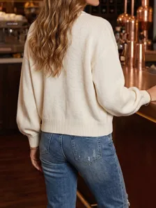 Detailed back view of a women's white crewneck knit sweater with lantern sleeves.