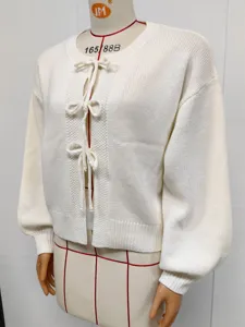 Solid color knitted cardigan detail, cute front bow ties and stylish lantern sleeves.