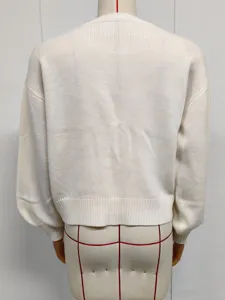 Back view of a solid color round neck knitted cardigan sweater, simple and casual style.