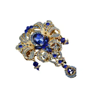 Eleganter goldfarbener Kronen-Brosche mit blauen Strasssteinen und Tropfenanhänger