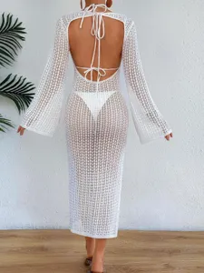 Detailed back view of white crochet mesh beach cover-up dress with backless tie design