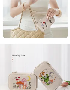 Detailed view of embroidered linen jewelry box with whimsical mushroom and frog motifs