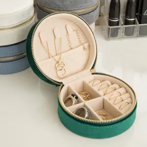 Portable emerald green velvet travel jewelry box with multiple compartments