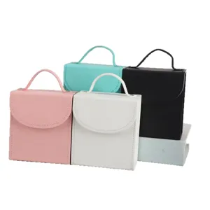 Portable square jewelry travel organizer boxes in four colors with stylish handles