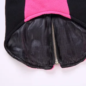 Detailed view of winter pet dog fleece jacket with zipper, black and pink color block.