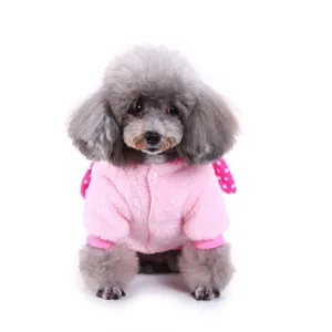 Detail shot of a cute pet winter fleece coat in pink, featuring soft plush material and snap buttons.