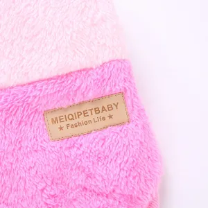 Pet winter fleece coat detail shot, soft pink color block design, warm apparel for small dogs.
