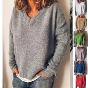 Close-up detail of the casual V-neck knit sweater in grey, showing soft texture and fit.