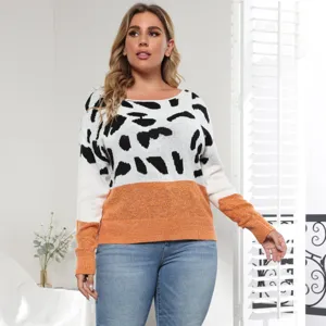 Plus size women's casual color-block sweater detail, showing the knit texture and stylish print.